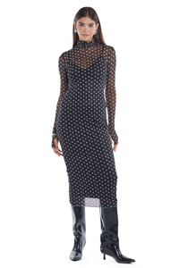 Vestido largo negro ideal para tus noches. Es ceñido al cuerpo, con mangas largas, cuello alto y malla con lunares ideal para brillar.